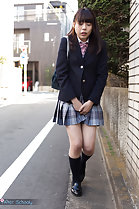 Student walking outdoors in uniform