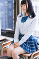 Momoki nozomi seated on school desk in uniform