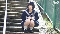 Short haired kogal seated on steps hands in fists upskirt panties