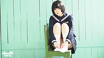 Sitting on chair knees raised short hair kogal uniform hands on her feet wearing white socks