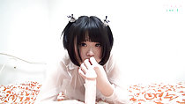 Minori lying on bed short hair hand raised to her mouth