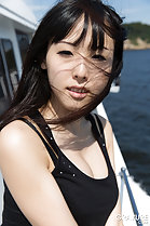 On boat wearing black top