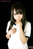 Long hair hand rasied to her lips
