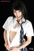 Unbuttoning her uniform shirt revealing her bra