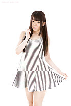 Playing with hem of her dress long hair