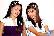 Abbie and Phey seated together hair bands long hair