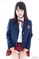 Student in uniform raising hem of plaid skirt exposing her panties