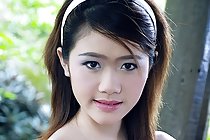 Sweet teen Kumja Moon strips and shares her slim body