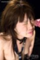Cum on her face wearing bondage chain