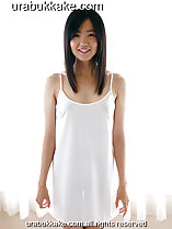 Wearing white slip standing in front of curtain window long hair down to her chest hands down by her side