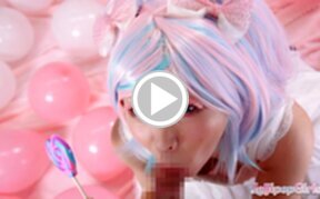 Minano Ai on her knees licking lollipop and sucking cock
